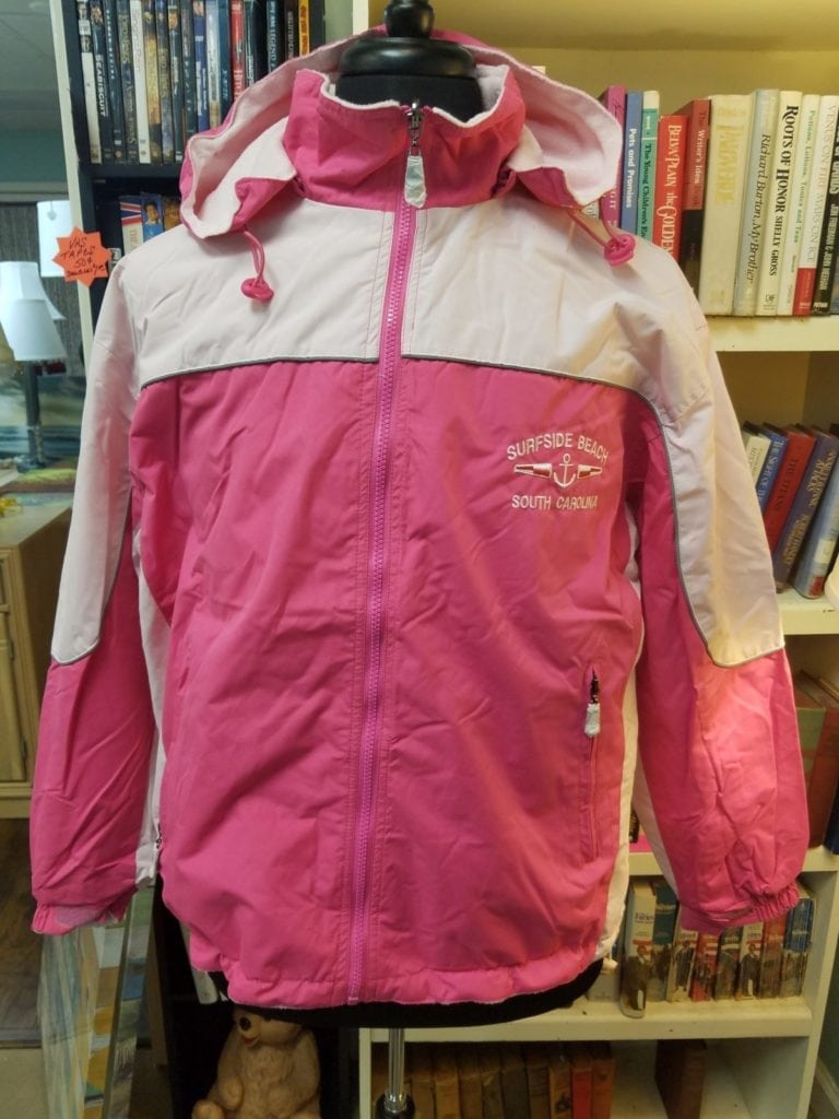 Reversible Coat • This coat is reversible with a zip off hood. Elastic cuffs and drawstrings at hips and hood make it great for walks on the beach! Water repellent and it is machine washable . Available in S - XXL.