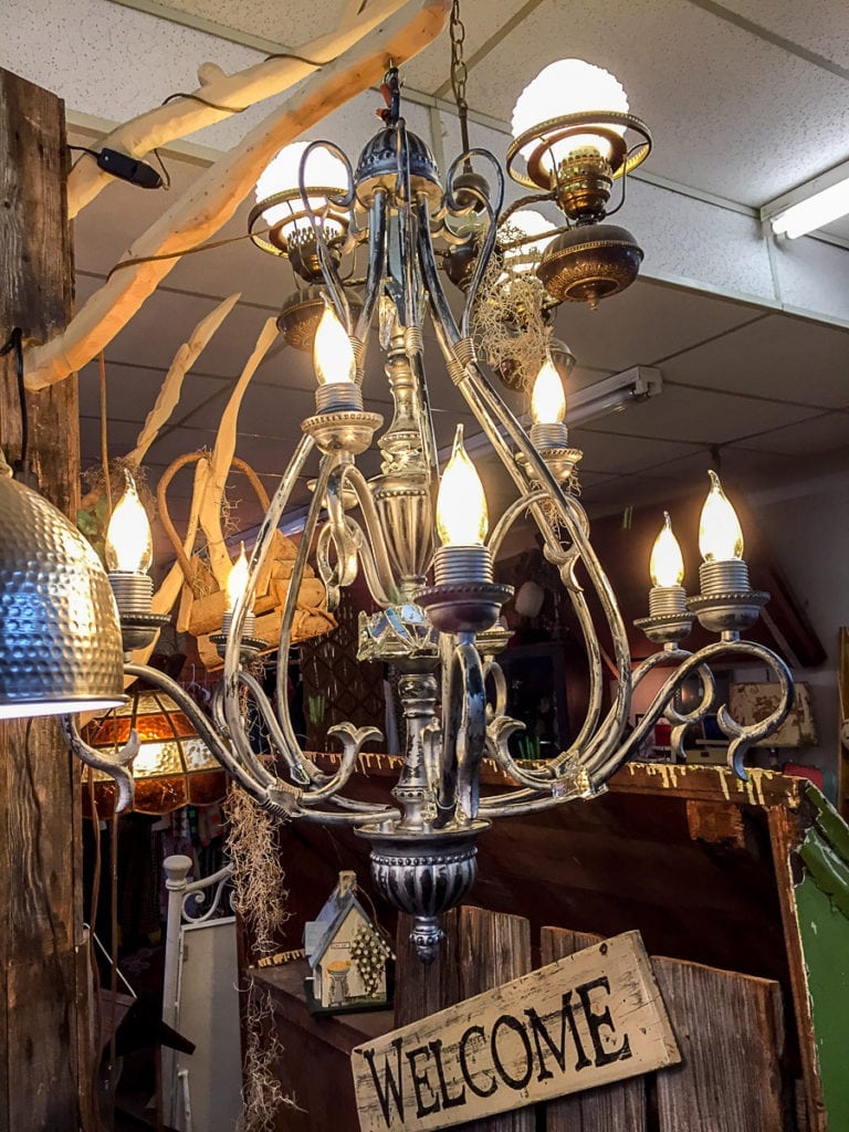 Unique Chandelier • This lovely vintage chandelier is artistically decorated with touches of 100 year old glass. This one of a kind piece will add elegance to any dining room. A must see!