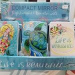 Compact Mirrors • Beautiful whimsical art on the compact. Open the compact for two mirrors on the inside, one is a regular mirror snd the other is a magnifying mirror. Great gift ideas!