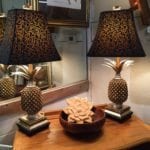 Pineapple Lamps • The pineapple is a traditional southern symbol of hospitality. These beautiful lamps will make any room in your house feel welcoming. Measuring 30" high with a 6 1/2" square base. They are priced separately and will be discounted if purchased together.