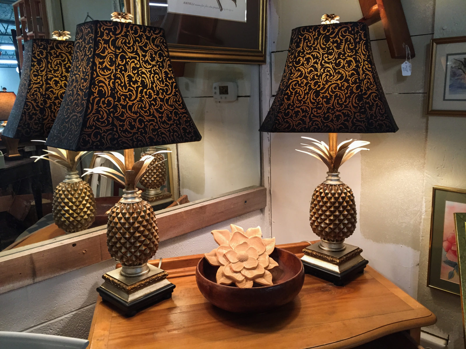 Pineapple Lamps • The pineapple is a traditional southern symbol of hospitality.  These beautiful lamps will make any room in your house feel welcoming. Measuring 30" high with a 6 1/2" square base. They are priced separately and will be discounted if purchased together.