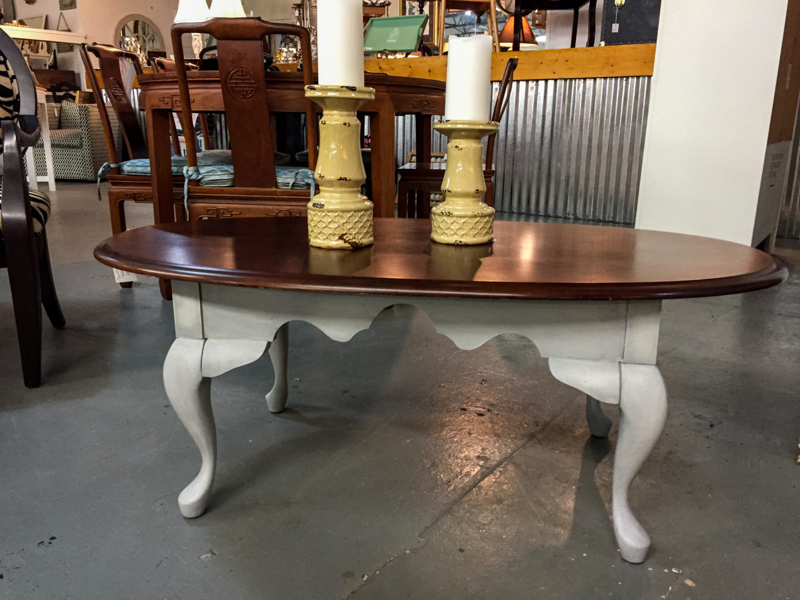 Oval Coffee Table • Gray chalk painted with dark gray shadowing and gray wax. Dark stained top was not touched, and can be custom re-stained or painted for you. Measures 45 1/2" x 23 1/2" x 17 1/2".