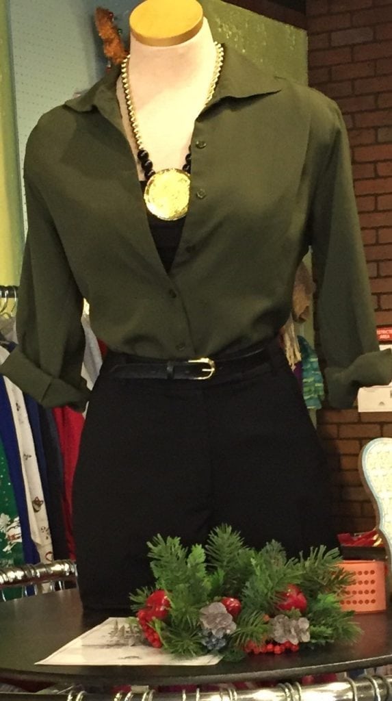 Green and black ensemble • Green and black ensemble paired with a black a gold necklace. All items sold separately.