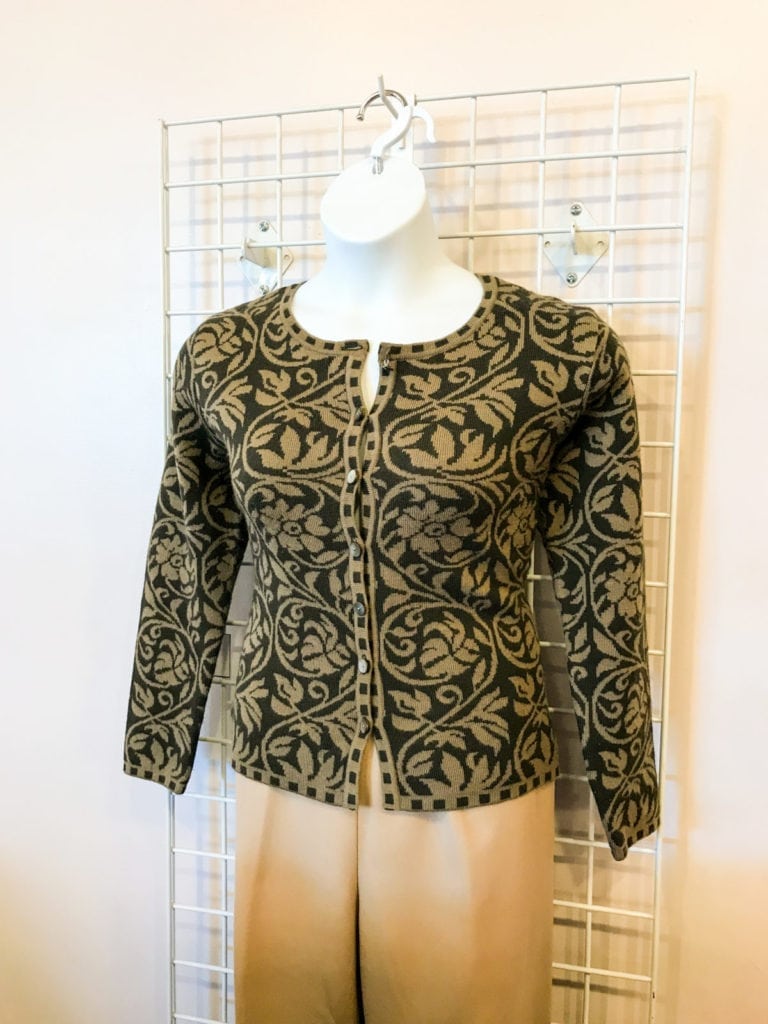 Stylish Button Sweater • Beautiful green and black patterned sweater. Size medium. Can be worn buttoned or open as a jacket. Perfect with tan or black pants. Also looks great with jeans and boots.