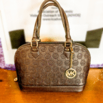 Michael Kors Handbag • Beautiful brown Michael Kors Handbag. This handbag is in very good condition and it just waiting for a new owner!