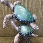 Turtles on coral • This resin statue of 2 turtles has beaitiful colors that you can use anywhere in your home.