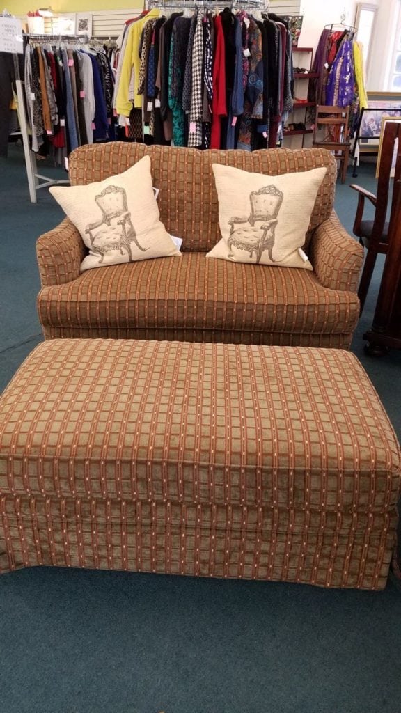 Brown tones loveseat & ottoman • Each piece sold separately.  Large ottoman on wheels.