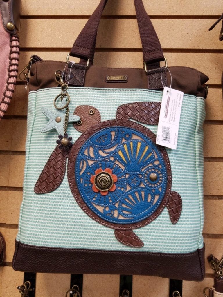 Chala crossbody bag • This whimsical turtle crossbody is the perfect size! Stop by and see our total collection. We can also special order for you if you don't see what you want.