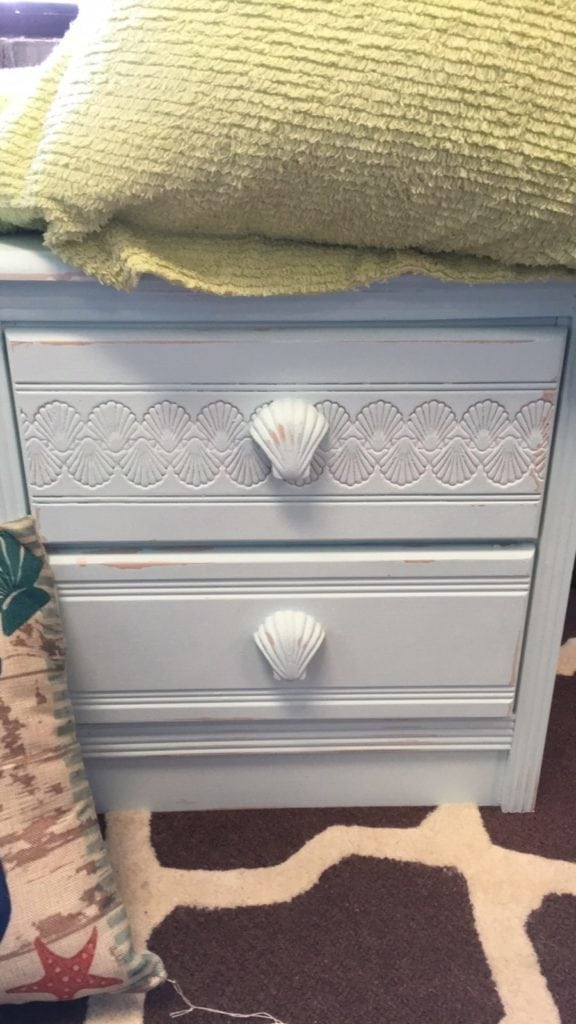 Shell Nightstands • Bring the beach home with one or both of these two drawer Nightstands featuring a shell design and decorative shell knobs. Pair with one of our chalk painted beds to create the perfect, inviting bedroom for home or your place at the beach