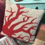 Vintage Hand Hooked Coral Pillow • Decorative Throw Pillow is a Unique hand hooked Pillow featuring a coral design perfectly suited to add a touch of the beach to any room in your house. White background with a coral colored design and velvet backing. Add to your sofa, rocker or club chair.