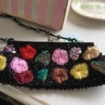 Sequined Floral Evening Bag • Unique sequined, Beaded and embroidered evening bag with a beaded strap. Wonderful gift for that special lady! She certainly won't see anyone else carrying this bag!