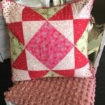 Heart Quilted Pillow • Charming hand made Pillow with assorted heart fabrics Quilted into a decorative 18" x 18" Pillow with a piped pink edge. Split back for cleaning or changing the insert out.