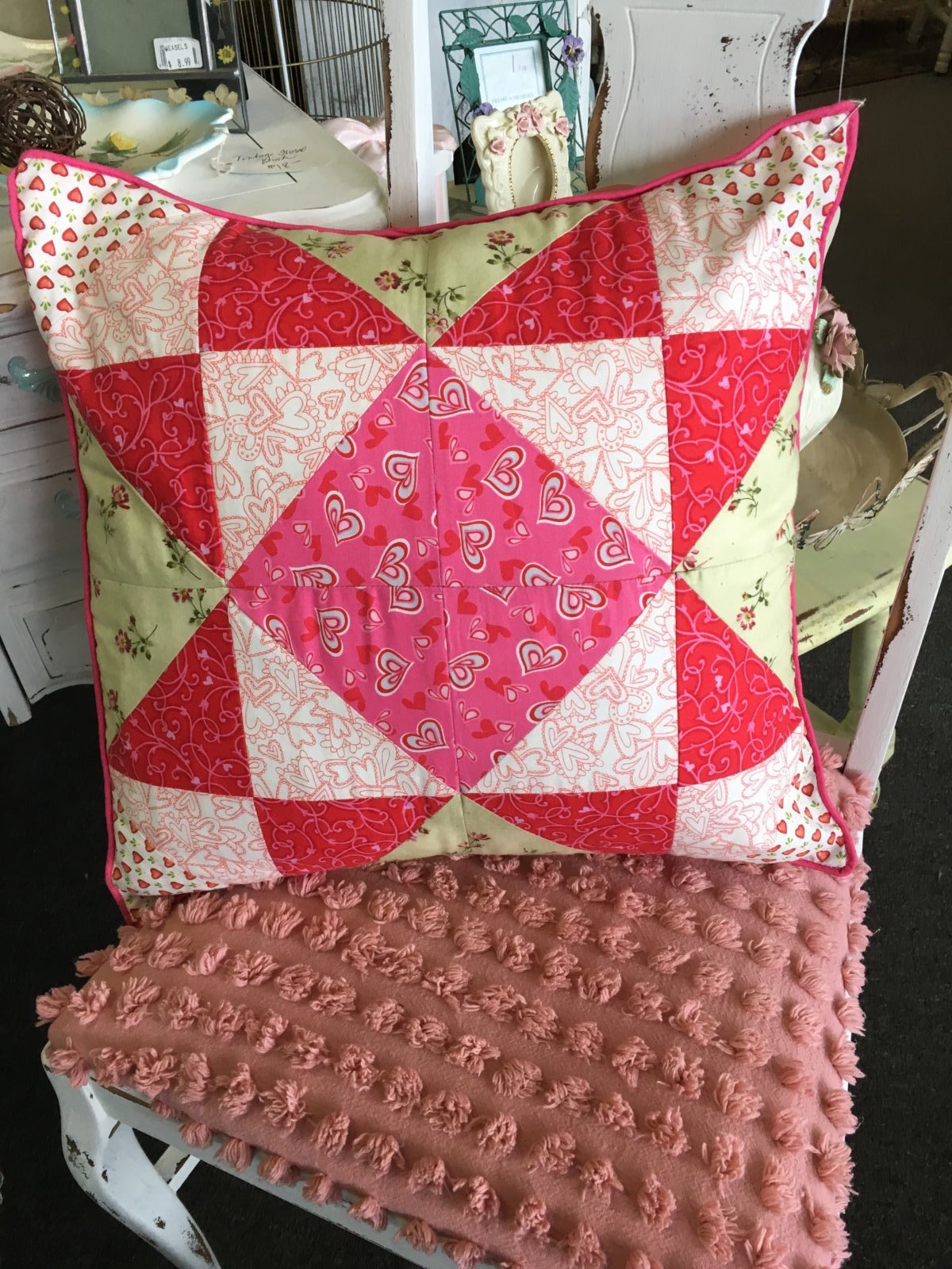 Heart Quilted Pillow • Charming hand made Pillow with assorted heart fabrics Quilted into a decorative 18" x 18" Pillow with a piped pink edge. Split back for cleaning or changing the insert out.