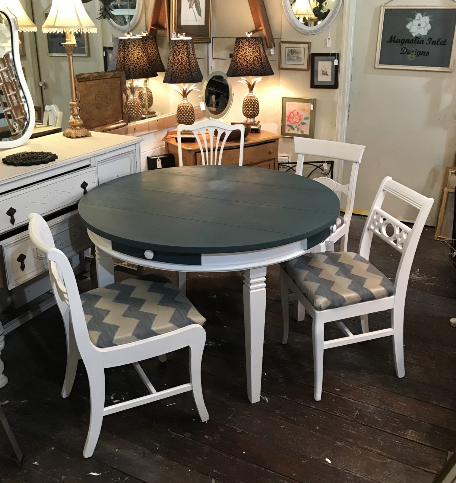 Dining table and four chairs • ReDesigned round dining table & four chairs. Each chair is unique, and coordinates beautifully with this lovely Homestead Blue and bright white. Table is large enough to seat 6. Four drawers for storage-napkins, flatware, etc.