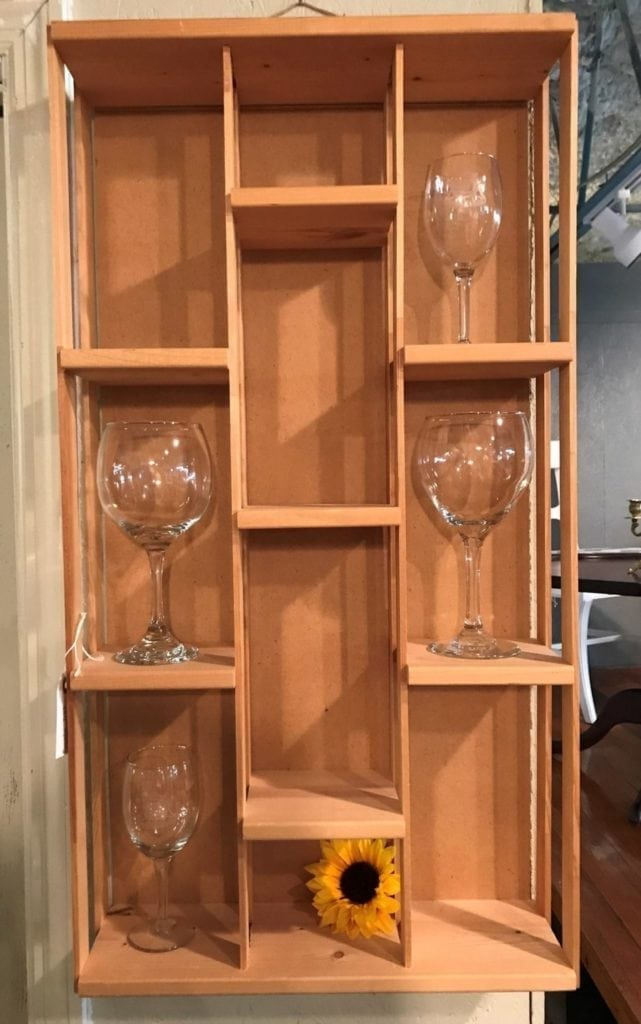 Hanging wood display shelf • Let us customize the finish fit you in this great display shelf. Here we’re using it to display wine glasses, but you can display any of your prizes here. 
Listed price does not include customization.