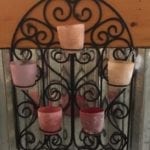Colorful Votive Holder • Metal and colored Glass combine in this fabulous hanging votive holder. Imagine this on your sun porch or back deck, with the colorful light flickering as you enjoy your favorite cool beverage, listening to your favorite music. How relaxing!