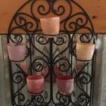 Colorful Votive Holder • Metal and colored Glass combine in this fabulous hanging votive holder. Imagine this on your sun porch or back deck, with the colorful light flickering as you enjoy your favorite cool beverage, listening to your favorite music. How relaxing!