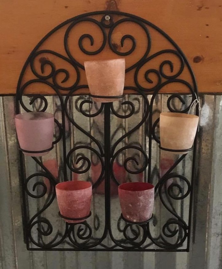 Colorful Votive Holder • Metal and colored Glass combine in this fabulous hanging votive holder. Imagine this on your sun porch or back deck, with the colorful light flickering as you enjoy your favorite cool beverage, listening to your favorite music. How relaxing!
