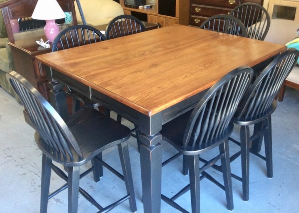 Counter height table w/8 chairs • Great buy on this black counterheight with newly refinished wood top with 8 chairs. Has hidden butterfly leaf under table. Table holds 6 chairs without leaf(54 x 42) and 8 chairs w leaf (54 x 54) retails new for $1300+ Why buy new? Buy gently used & save $