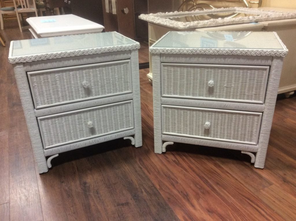 Like new Henry link nightstands • Great buy on these two like new Henry link white wicker nightstands. Has glasstops.
