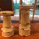 Ceramic pillar candleholders • This pair of ceramic pillar candleholders are a lovely creamy yellow with a rusty distressed look. Candles add lovely ambiance in any room, and this pair is a great neutral color that will compliment any decor.