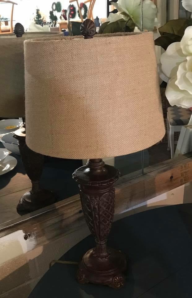 Carved Wood Lamp • Neutral brown with burlap shade makes this single lamp a nice addition to your decor! Any place you need additional task or ambient lighting.
