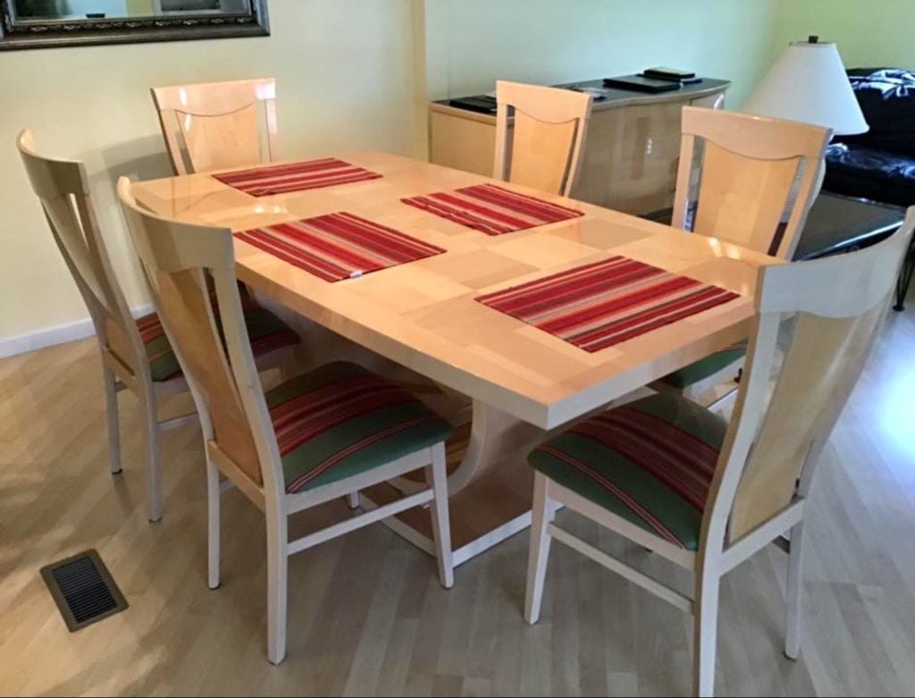 Italian LAQUERED Table 6chairs • Great buy on this lacquered finished table with hidden leaf and six fabric chairs. This set was made in Italy and is in like new condition. 73" by 43" without leaf in. Very cool lines very heavy and sturdy. Must see to appreciate its value.In Italy $1600+