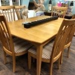 Wood Rectangle Tabe w/6 chairs • Nice wood rectangle dining table with 6 chairs. Chairs have striped fabric seats in a brown color scheme. 64” by 42” 2 20” leaves