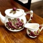 Red Berries Tea Pot & Creamer • Adorable red berries tea pot and creamer. Makes a nice accent color in a kitchen.