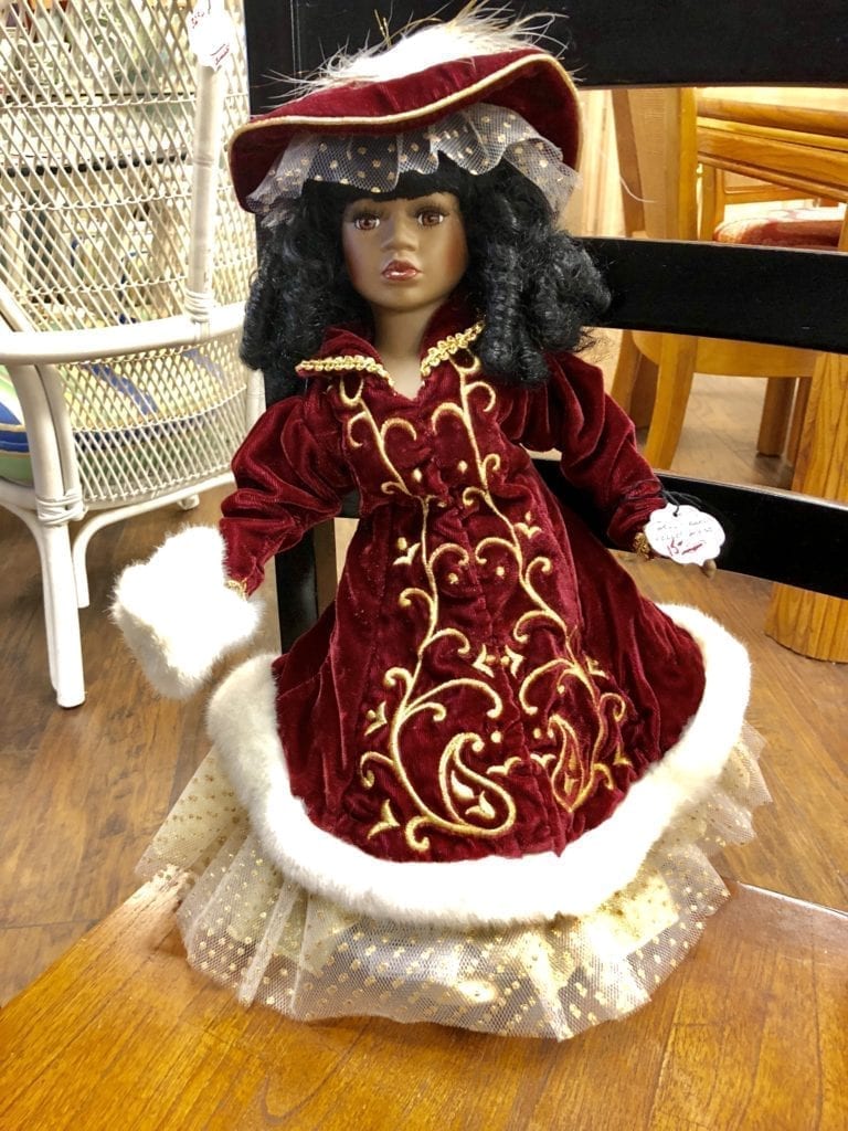 Porcelain Doll w/Burgandy Dress • This beautiful porcelain doll is all dressed up for winter with this burgundy with white fur coat.