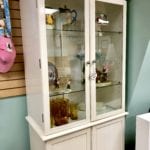 White Glass Door Cabinet • White glass door cabinet is perfect for displaying your China or other valued treasures. Has glass shelves and closed storage below.