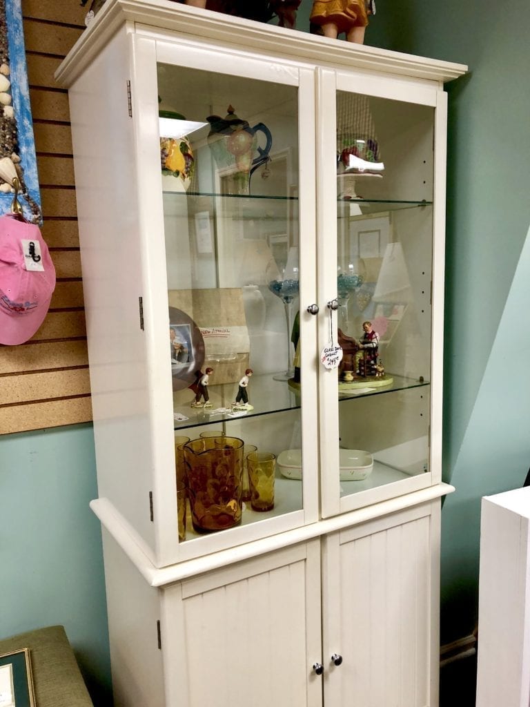 White Glass Door Cabinet • White glass door cabinet is perfect for displaying your China or other valued treasures. Has glass shelves and closed storage below.