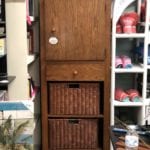 Oak Armoire • Beautiful oak armoire with a cabinet door, one drawer and two baskets below. Great for any entrance to stow shoes, compact umbrellas and more. A pretty piece for any home. On sale for $199