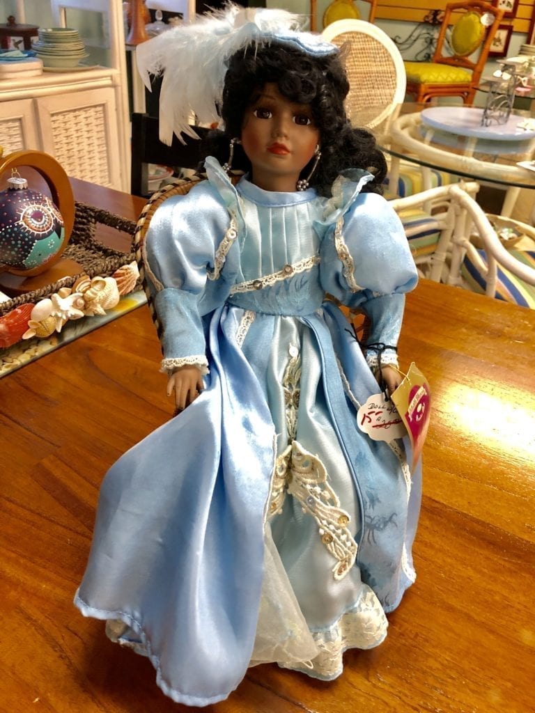 Doll with Chair • Call all doll collectors! This porcelain doll with chair is a real beauty in a light blue dress and fancy hat.