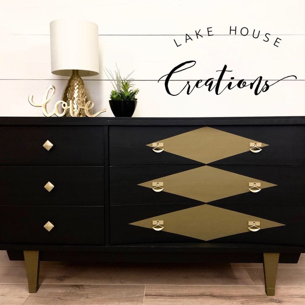 Vintage Mid Century Modern Dresser • This dresser has been refinished in Coal Black with bronze metallic accents. Large drawers feature a unique curved shape.
Hardware has a new brushed gold finish. (W)52” x (D)18” x (H)30”
Visit us at https://www.facebook.com/lakehousecreations2018
