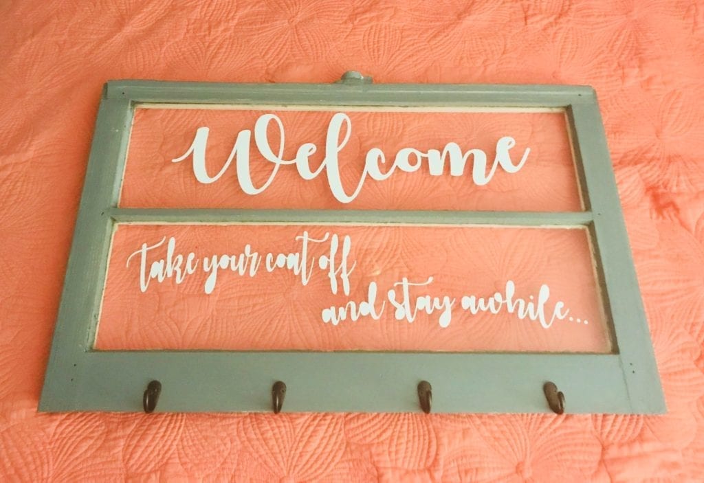 Welcome Entry Sign • Repurposed wood framed window into a multi-purpose entryway sign with hooks for coats, book bags, handbags or hats. Measures 32”x20”.
Delivery available. Price does not include delivery. 
Taking orders for custom Designs. Contact me for details.