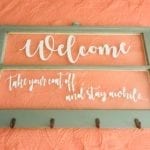 Welcome Entry Sign • Repurposed wood framed window into a multi-purpose entryway sign with hooks for coats, book bags, handbags or hats. Measures 32”x20”.
Delivery available. Price does not include delivery. 
Taking orders for custom Designs. Contact me for details.